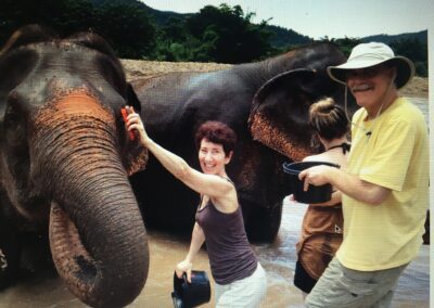 Author Annie Fox and husband David Fox at an elephant refuge in Chiang Mia, Thailand