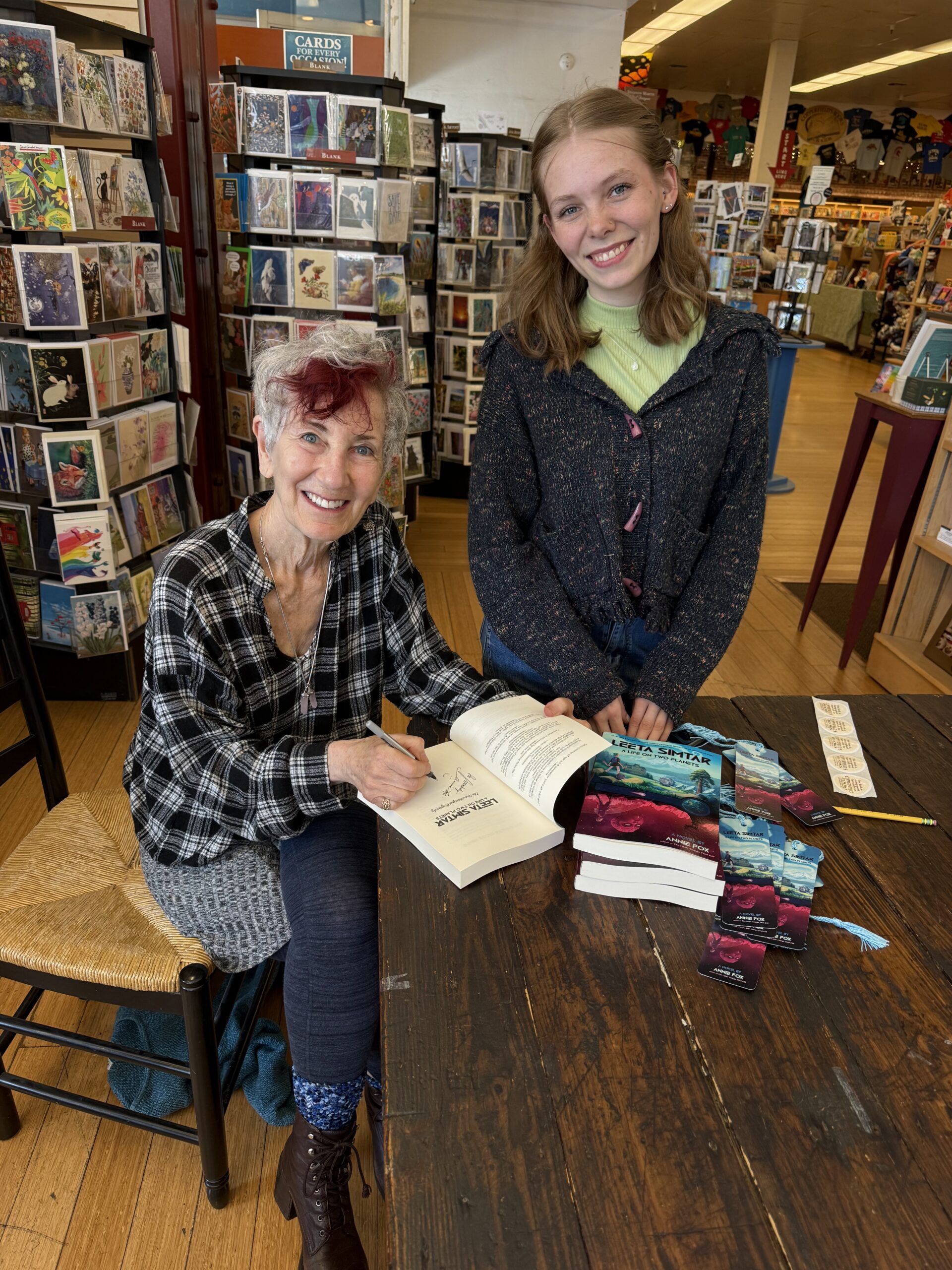 Author Annie Fox signing her book for Copperfield's Kathryn Potts